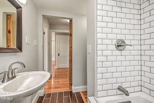 350 Texas Ave, Bristol, VA 24201 - full bath with shower / bath combination, a sink, and wood finished floors