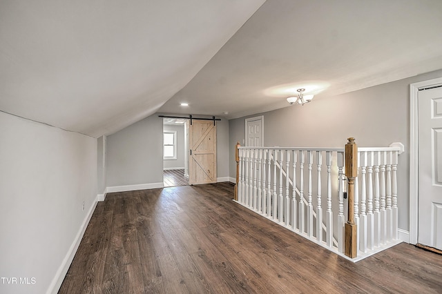350 Texas Ave, Bristol, VA 24201 - bonus room with an inviting chandelier, a barn door, baseboards, wood finished floors, and vaulted ceiling