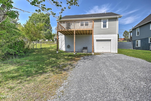 350 Texas Ave, Bristol, VA 24201 - view of front of house with an attached garage, fence, a front lawn, and gravel driveway