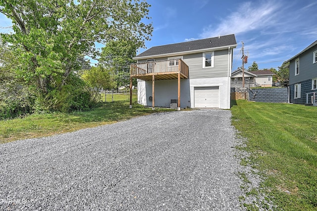 350 Texas Ave, Bristol, VA 24201 - view of front of house with a front lawn, fence, a deck, an attached garage, and driveway
