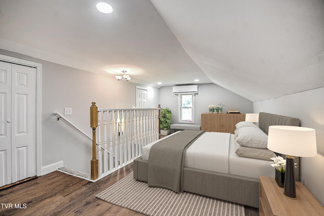350 Texas Ave, Bristol, VA 24201 - bedroom featuring an AC wall unit, recessed lighting, baseboards, wood finished floors, and vaulted ceiling