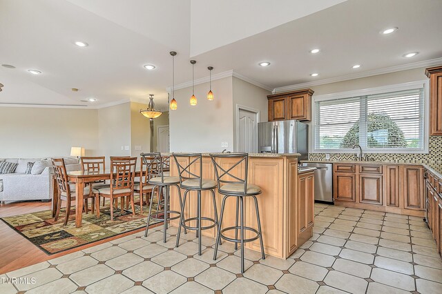 260 Dominique Ln, Greeneville, TN 37743 - kitchen with crown molding, open floor plan, a breakfast bar area, recessed lighting, and stainless steel appliances