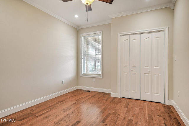 260 Dominique Ln, Greeneville, TN 37743 - unfurnished bedroom featuring light wood finished floors, baseboards, visible vents, ornamental molding, and a closet