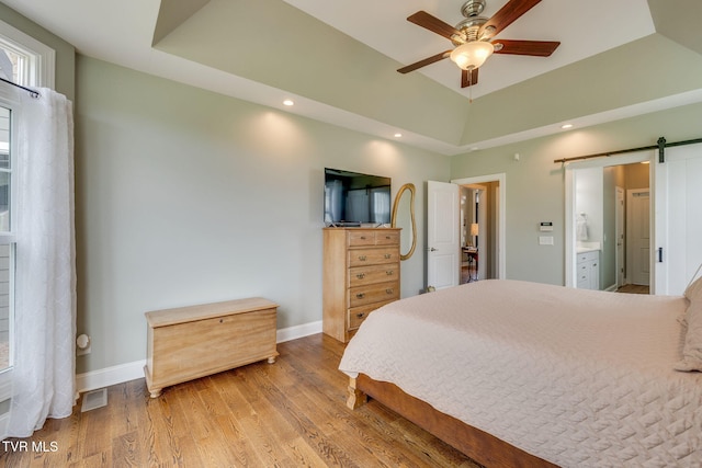 145 Grande Harbor Way, Blountville, TN 37617 - bedroom with a tray ceiling, a barn door, wood finished floors, baseboards, and recessed lighting