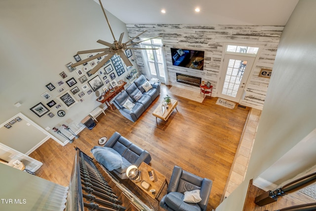145 Grande Harbor Way, Blountville, TN 37617 - living area with a towering ceiling, a ceiling fan, a fireplace, recessed lighting, and wood finished floors