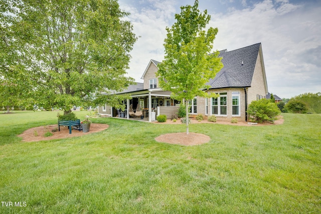 145 Grande Harbor Way, Blountville, TN 37617 - back of house featuring a patio, a yard, a shingled roof, and brick siding