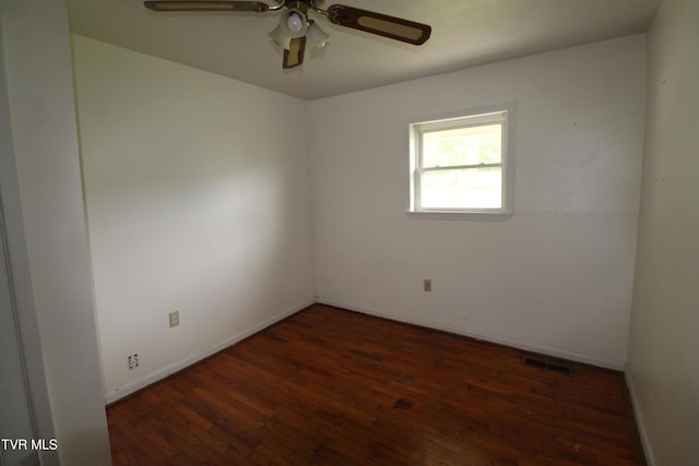empty room with visible vents, baseboards, ceiling fan, and wood finished floors