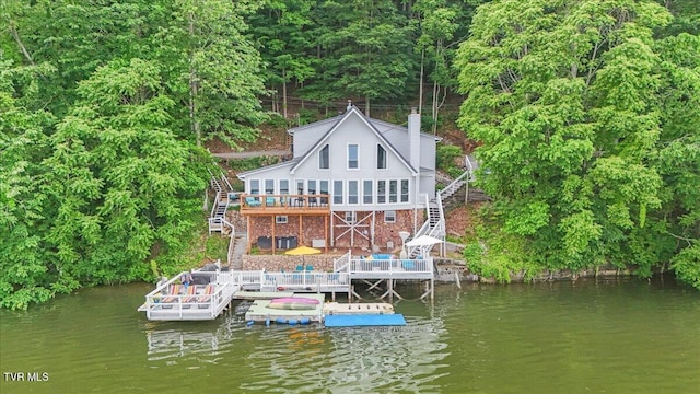 196 Furches Dr, Gray, TN 37615 - back of house featuring stairway, a deck with water view, a chimney, and boat lift