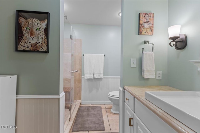 196 Furches Dr, Gray, TN 37615 - full bath featuring a stall shower, toilet, wainscoting, tile patterned floors, and vanity