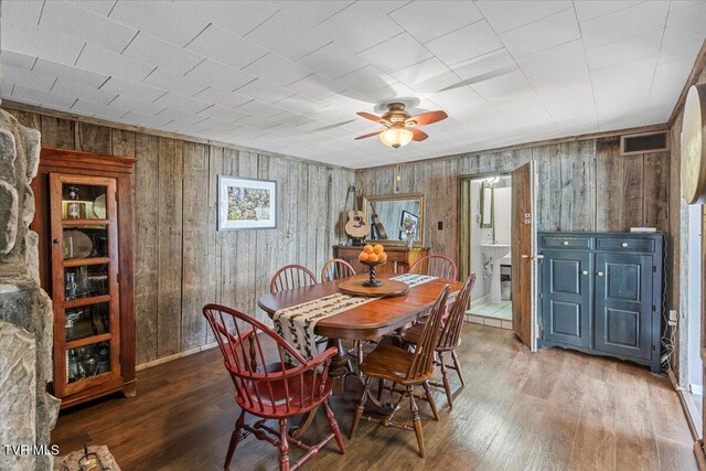 196 Furches Dr, Gray, TN 37615 - dining space with wooden walls, wood finished floors, and a ceiling fan