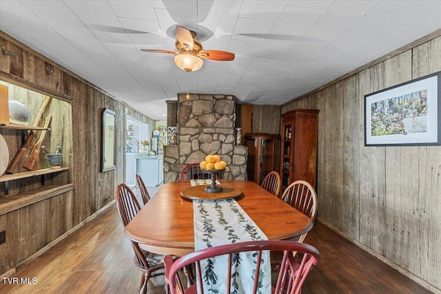 196 Furches Dr, Gray, TN 37615 - dining area with wood walls, wood finished floors, ceiling fan, baseboards, and washer / dryer