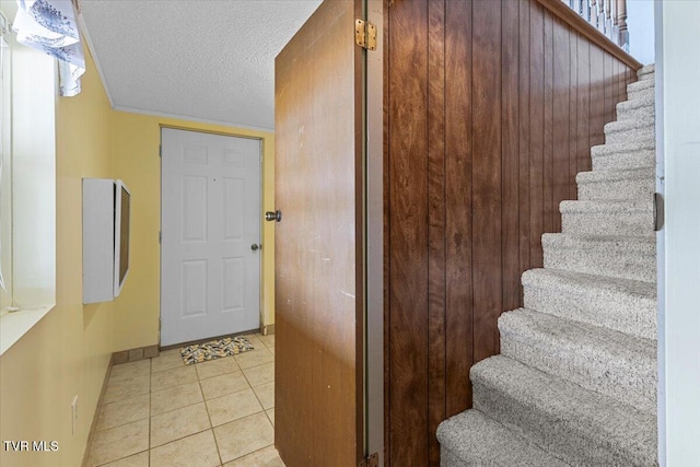 196 Furches Dr, Gray, TN 37615 - staircase featuring a textured ceiling, baseboards, and tile patterned floors