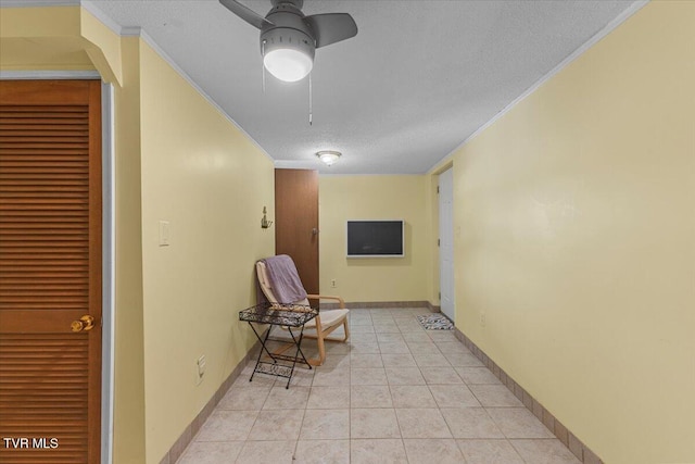 196 Furches Dr, Gray, TN 37615 - hall featuring crown molding, a textured ceiling, light tile patterned flooring, and baseboards