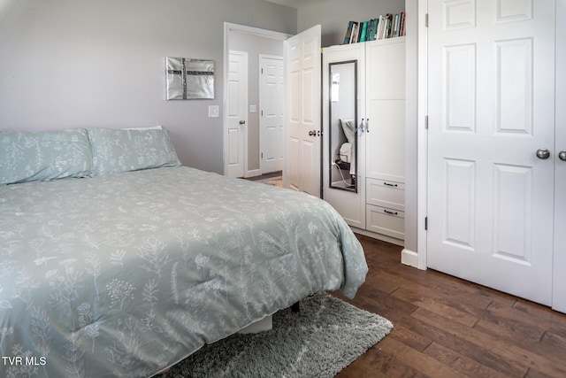 bedroom with hardwood / wood-style floors