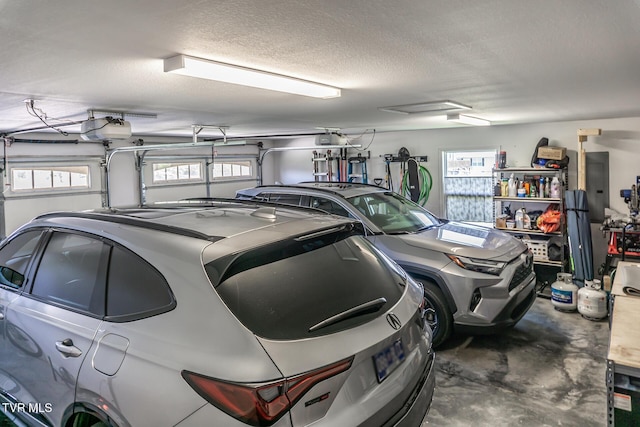 garage with electric panel and a garage door opener