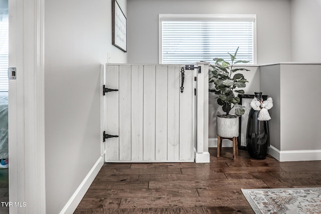 details featuring baseboards and wood finished floors