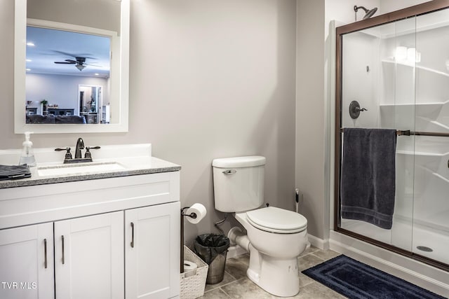 full bath featuring vanity, toilet, a stall shower, and ceiling fan