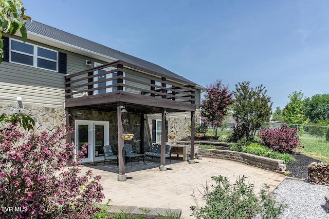 view of patio / terrace with fence and french doors