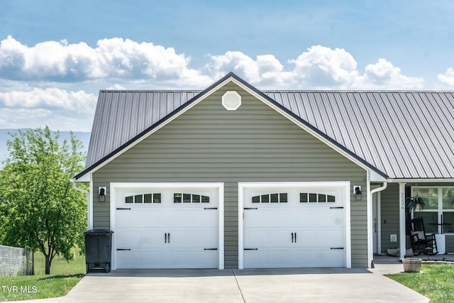 garage with concrete driveway