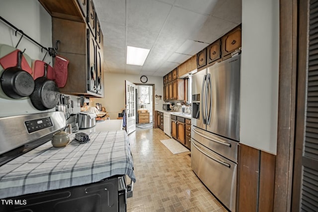 kitchen featuring stainless steel refrigerator with ice dispenser, tile countertops, a heating unit, and white dishwasher