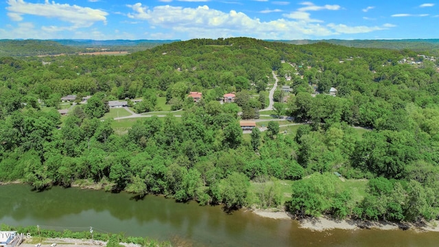 aerial view featuring a water view and a forest view