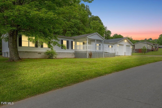 269 Rocky Branch Rd, Elizabethton, TN 37643 - view of front of house with covered porch, a front lawn, crawl space, and a detached garage