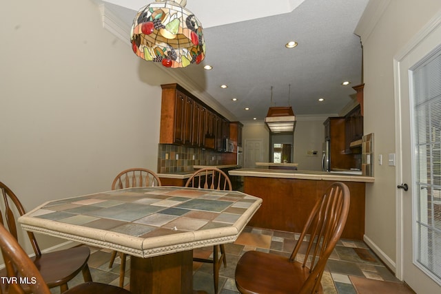 dining room featuring crown molding, baseboards, recessed lighting, and stone tile floors