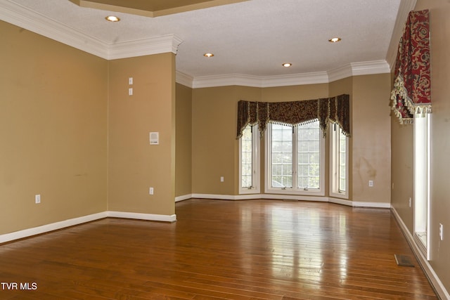unfurnished room featuring baseboards, ornamental molding, recessed lighting, and hardwood / wood-style floors