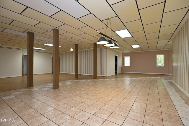 spare room featuring light tile patterned flooring