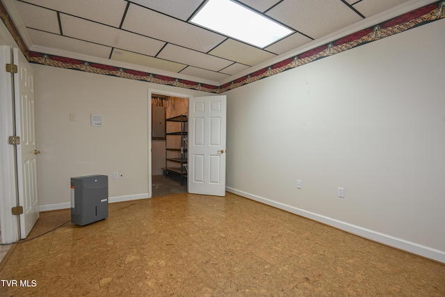 empty room featuring tile patterned floors and baseboards