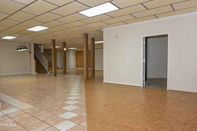 unfurnished room featuring crown molding and stairway