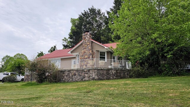 616 SE Kiser Ave, Coeburn, VA 24230 - view of side of property with a lawn, a chimney, and metal roof