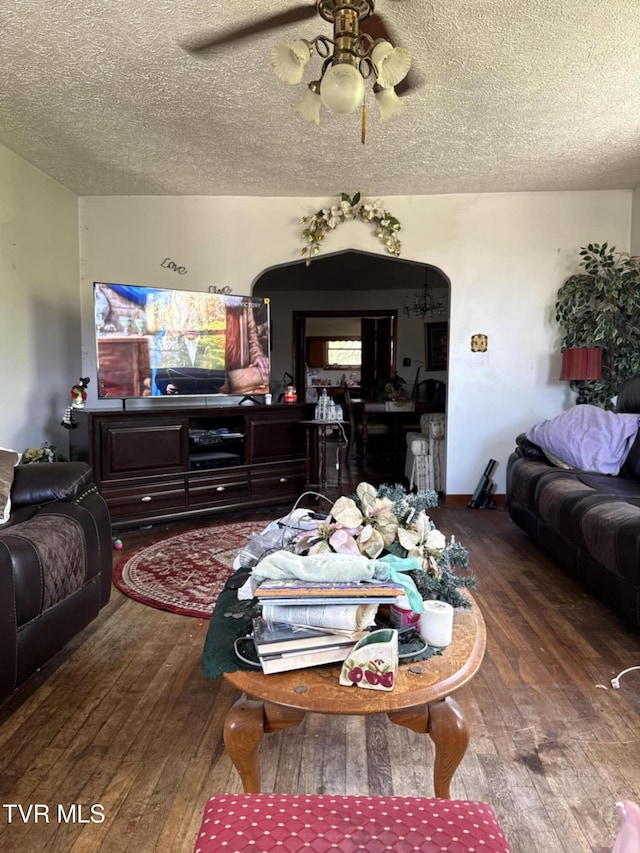 616 SE Kiser Ave, Coeburn, VA 24230 - living area with arched walkways, ceiling fan, wood-type flooring, and a textured ceiling
