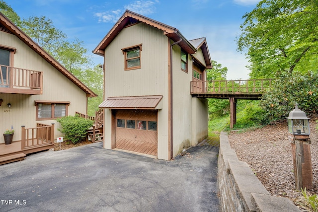 exterior space featuring a deck and a balcony
