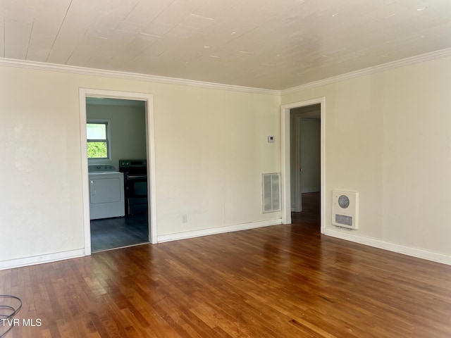 1001 Gibson Mill Rd, Kingsport, TN 37660 - empty room with washer / clothes dryer, visible vents, heating unit, and wood finished floors