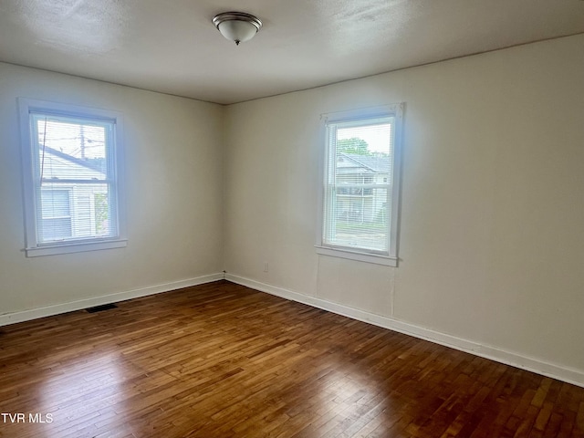 1001 Gibson Mill Rd, Kingsport, TN 37660 - spare room featuring baseboards, visible vents, and hardwood / wood-style flooring