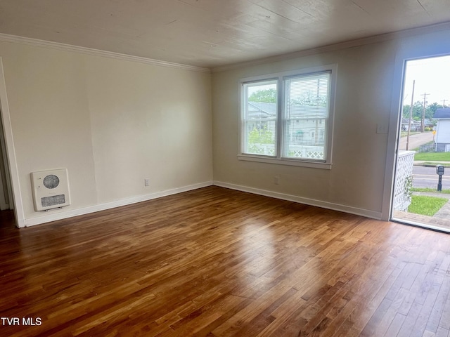 1001 Gibson Mill Rd, Kingsport, TN 37660 - unfurnished room with dark wood-style flooring, baseboards, heating unit, and ornamental molding