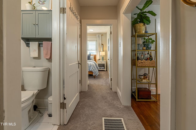 interior space featuring visible vents and carpet flooring