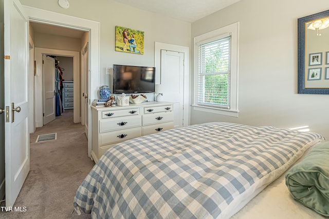 bedroom featuring carpet flooring and visible vents