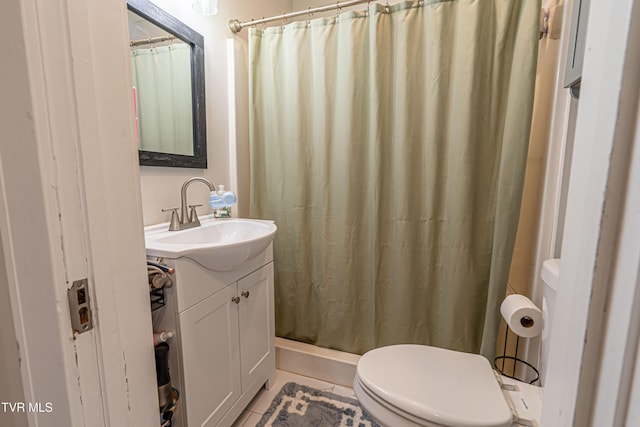 full bathroom featuring vanity, tile patterned flooring, curtained shower, and toilet
