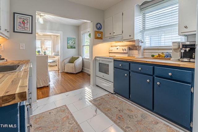 kitchen featuring white electric stove, butcher block counters, and blue cabinets