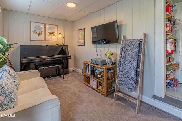 carpeted living room with baseboards