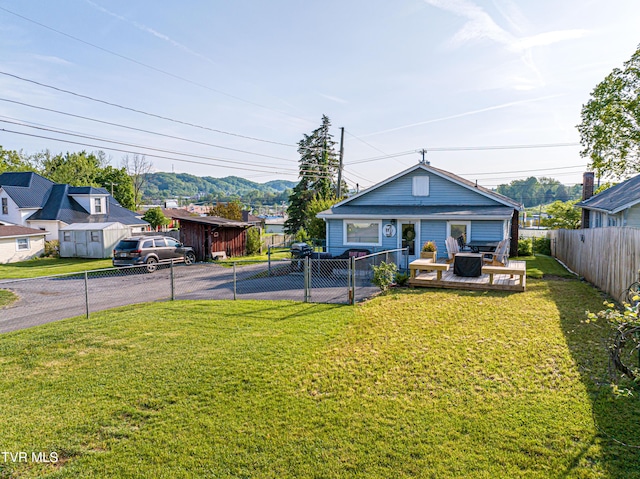 exterior space with a fenced backyard and aphalt driveway