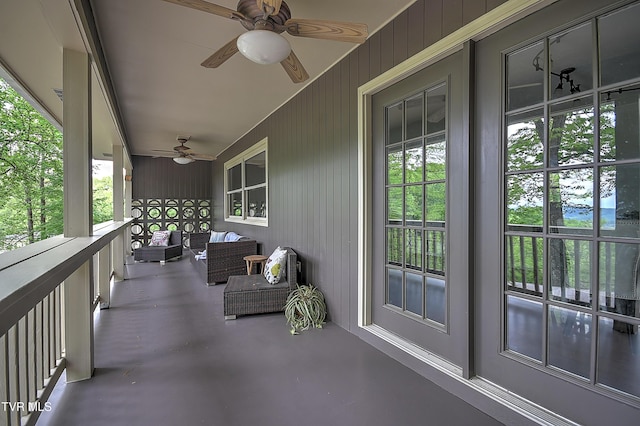 balcony featuring a porch and ceiling fan