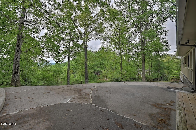 view of patio featuring a forest view