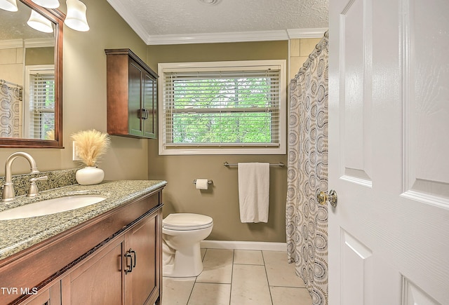 bathroom with vanity, ornamental molding, toilet, and tile patterned flooring