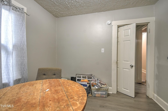 921 E Sevier Ave, Kingsport, TN 37660 - dining area featuring a textured ceiling and wood finished floors