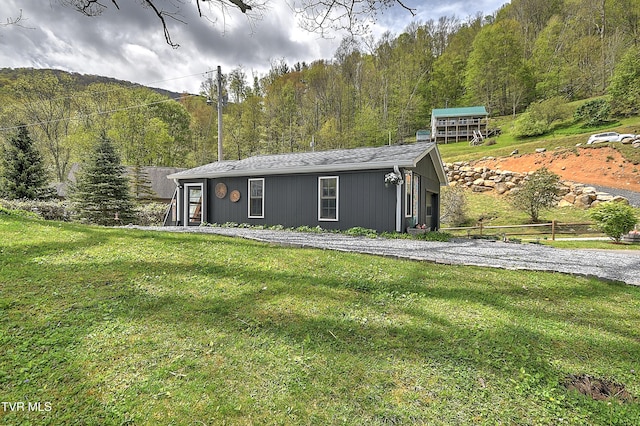 190 Roanwood Rd, Roan Mountain, TN 37687 - view of front of property featuring a view of trees and a front lawn