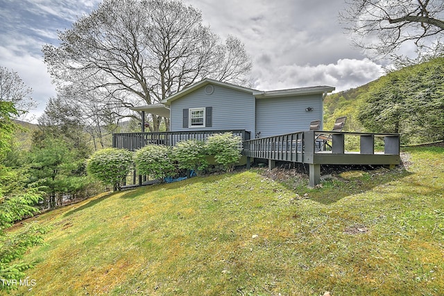 190 Roanwood Rd, Roan Mountain, TN 37687 - back of property with a yard and a wooden deck