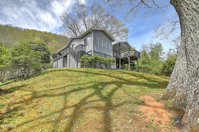 190 Roanwood Rd, Roan Mountain, TN 37687 - view of property exterior with a yard and a deck